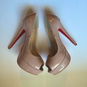 Never worn Christian Louboutin nude patent heel.Comes with a box and dust bag.